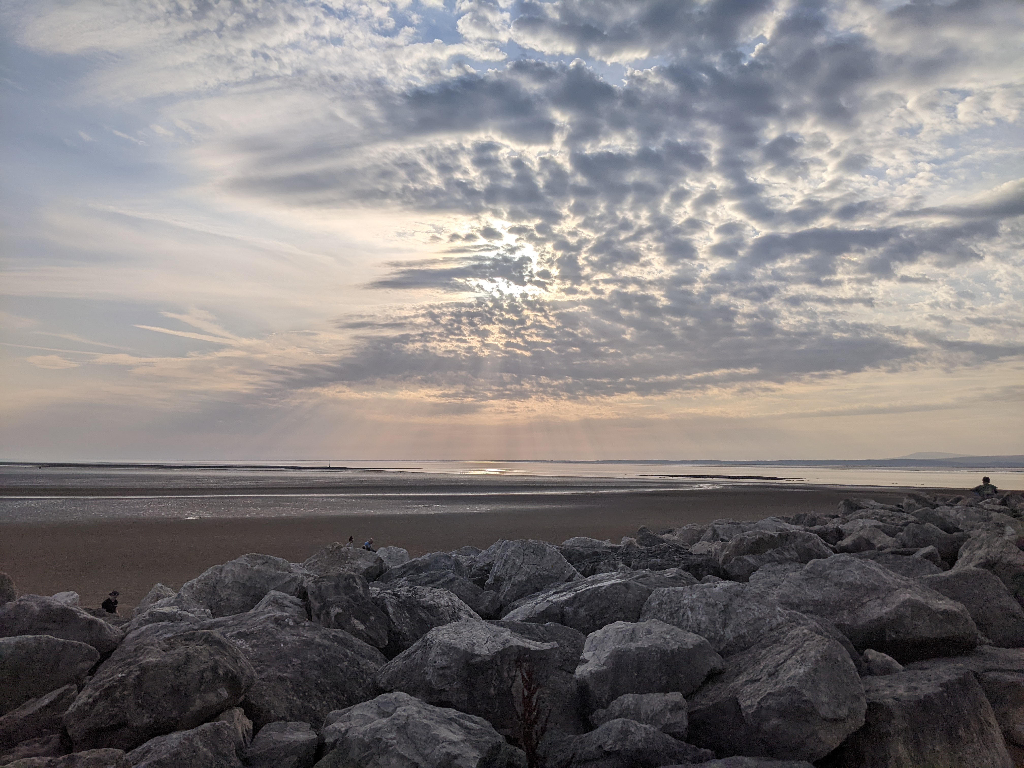 A shot of Morecambe bay during the eclipse, with the sun mostly obscured by clouds