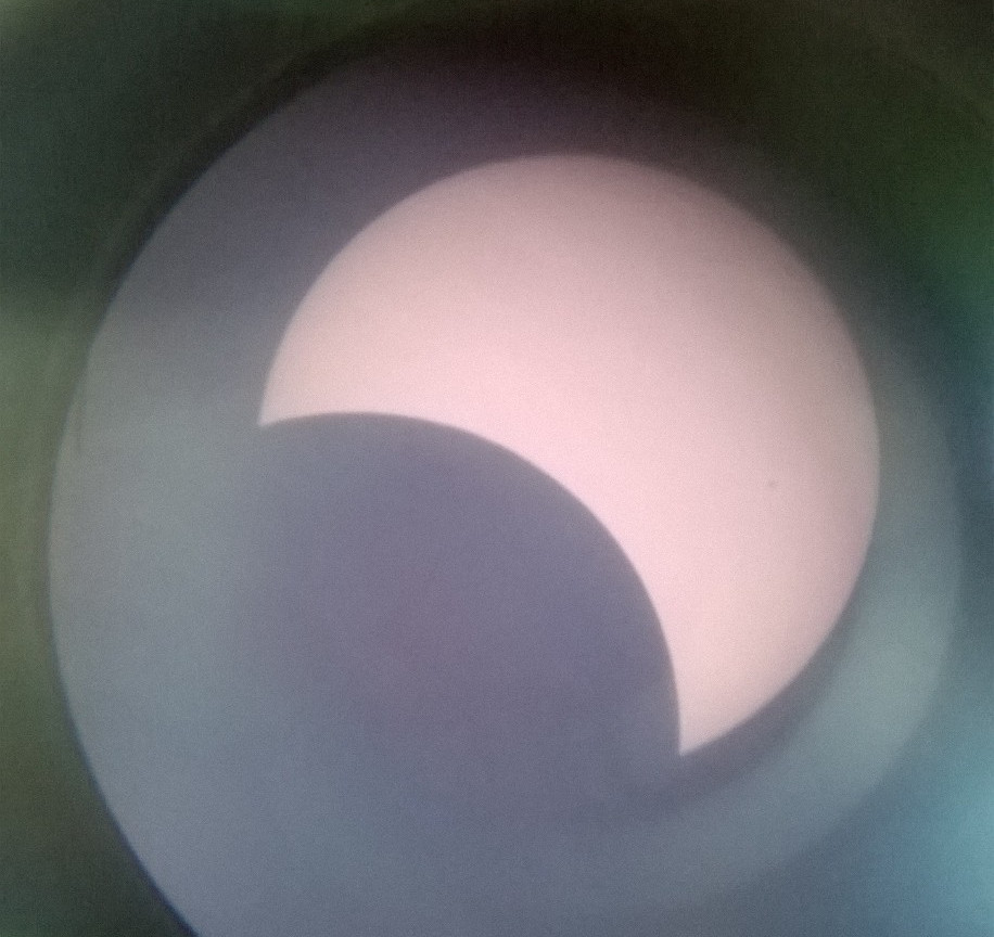 The sun during the March 2015 solar eclipse with about a third in the bottom left blocked be the moon